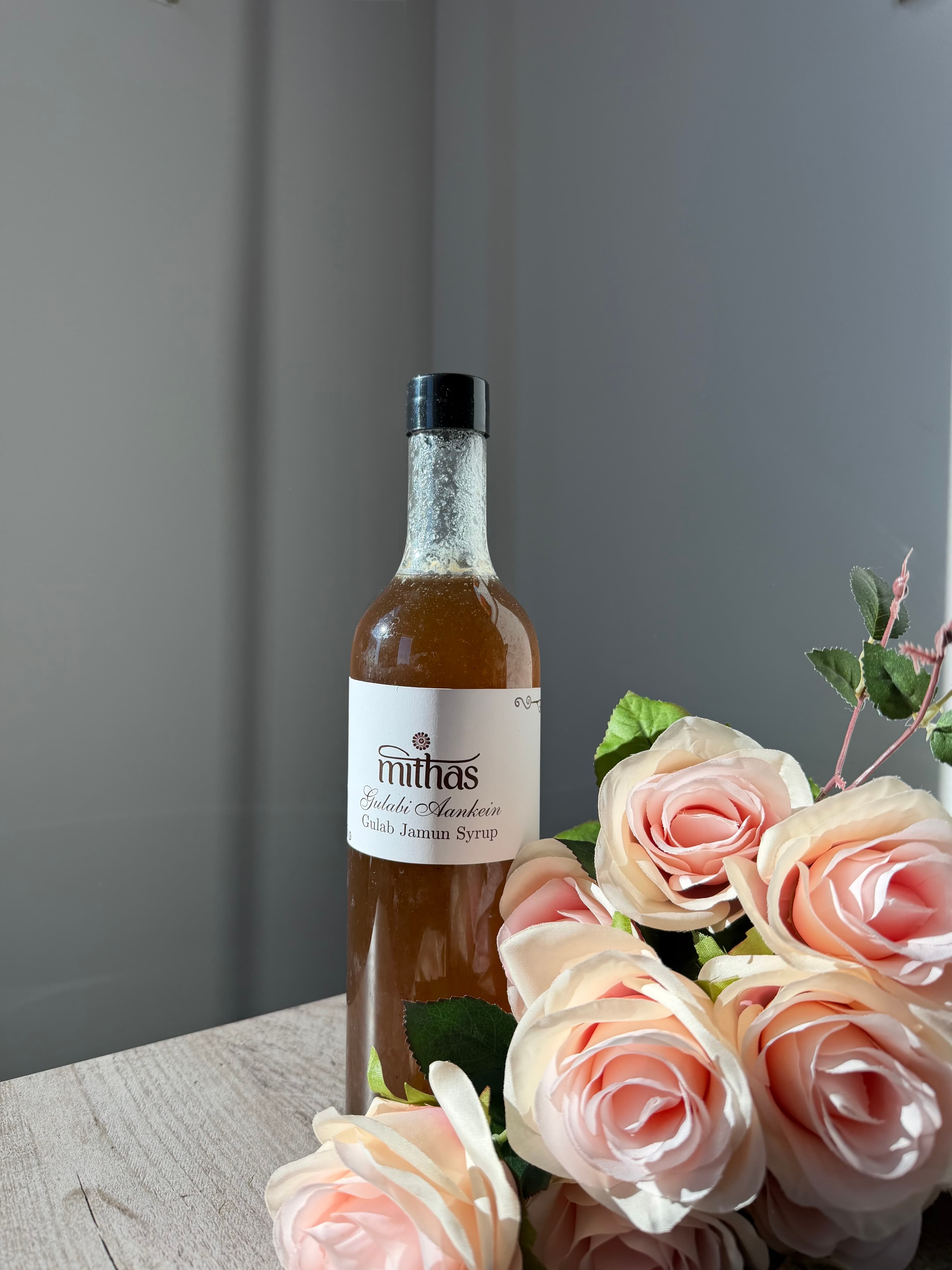 Mithas Gulab Jamun syrup bottle with roses